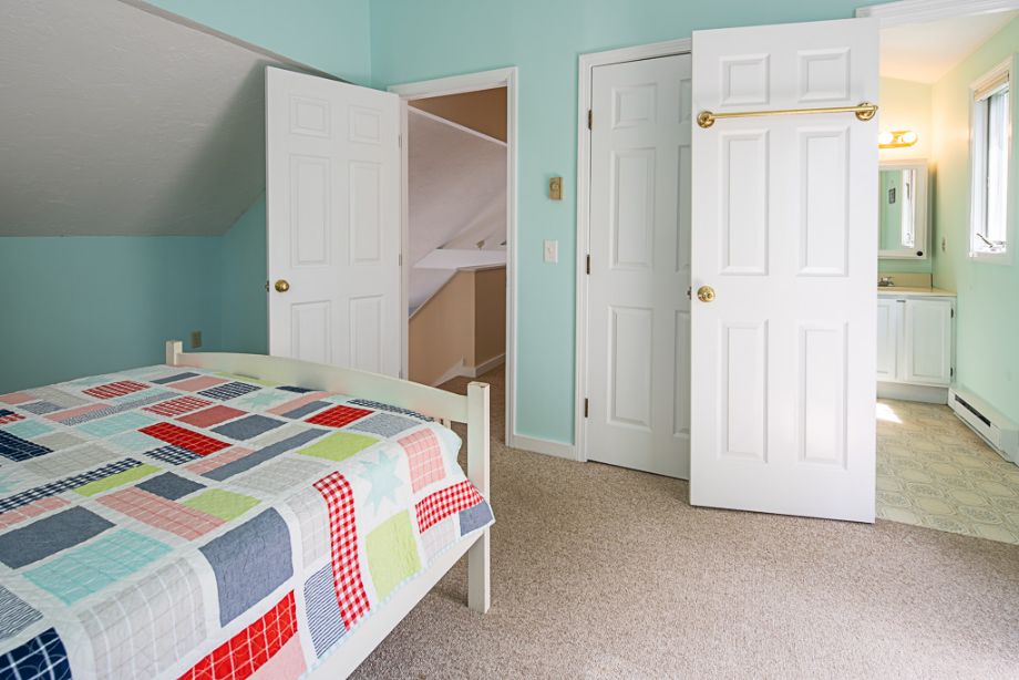33 Codman Spring Road Edgartown, MA 02539 - Photo 18 of 24 a bedroom with a bed and a refrigerator