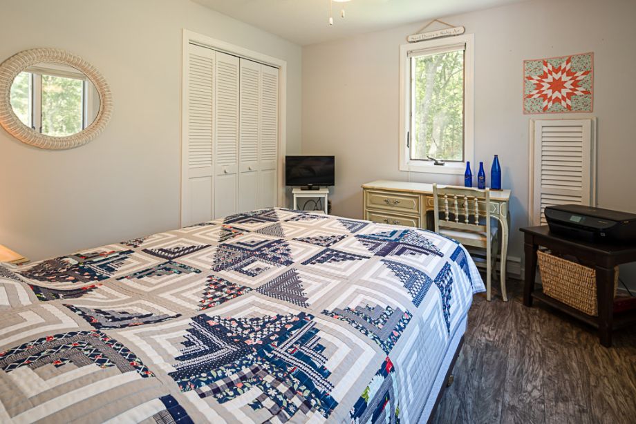 33 Codman Spring Road Edgartown, MA 02539 - Photo 19 of 24 a bedroom with a bed and a window
