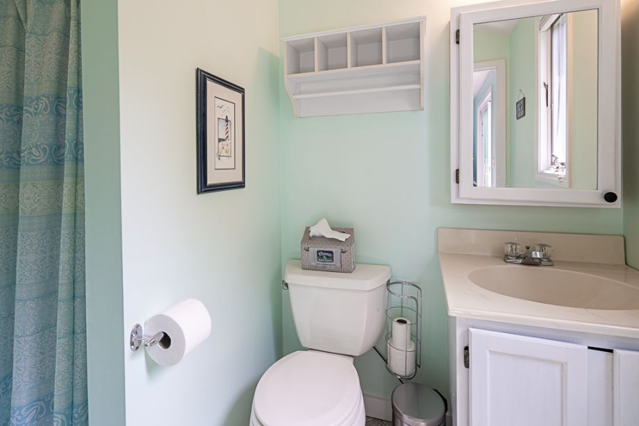 33 Codman Spring Road Edgartown, MA 02539 - Photo 20 of 24 a bathroom with a toilet sink and mirror