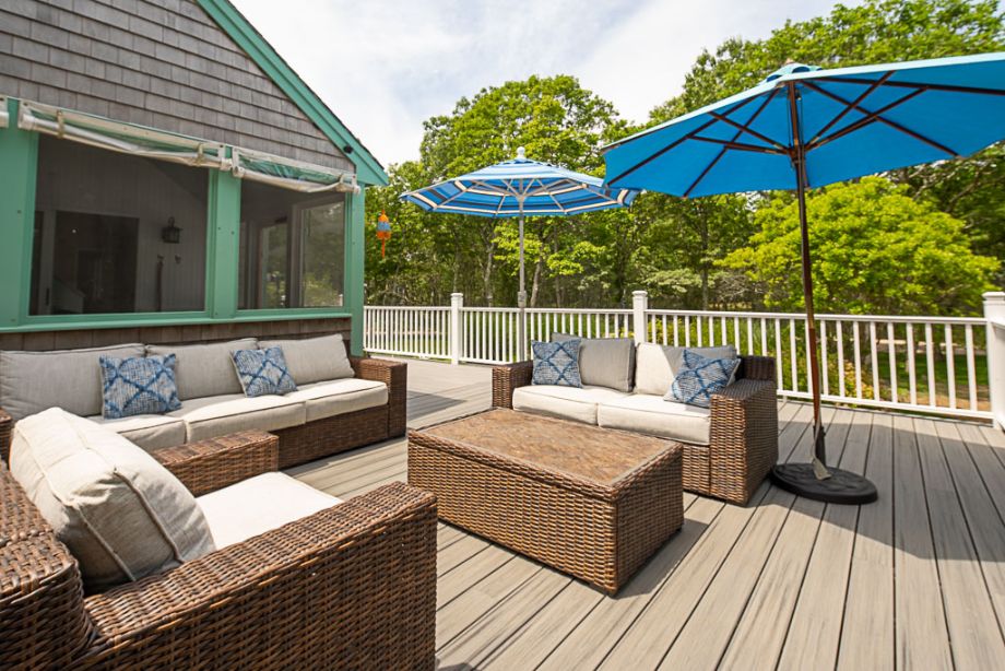 33 Codman Spring Road Edgartown, MA 02539 - Photo 21 of 24 a view of a patio with a table and chairs