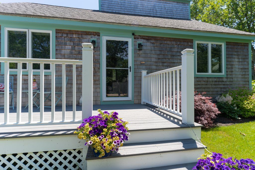 33 Codman Spring Road Edgartown, MA 02539 - Photo 3 of 24 a front view of a house with a garden
