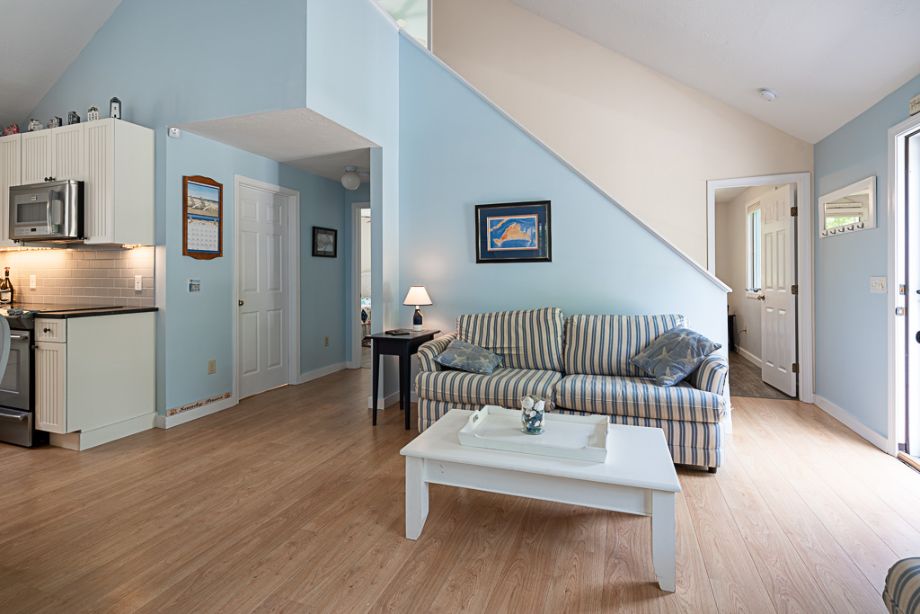 33 Codman Spring Road Edgartown, MA 02539 - Photo 8 of 24 a view of a hallway with wooden floor windows and stairs