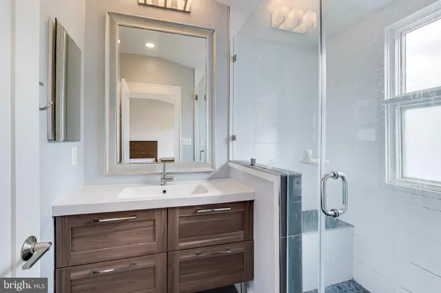 a sink with a mirror