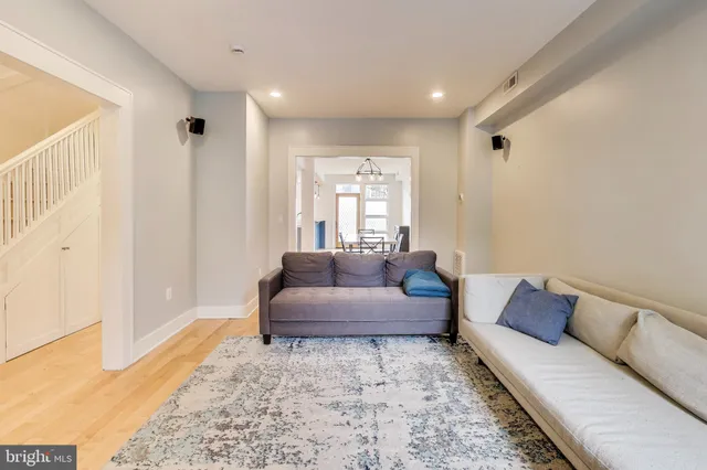 a living room with furniture and a rug