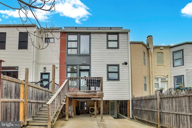 a view of a house with iron stairs