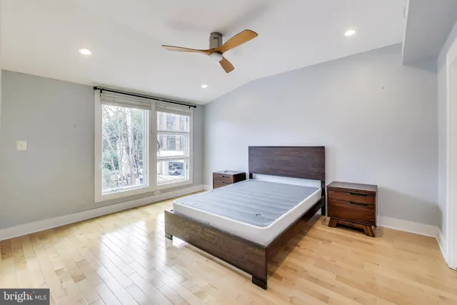 a bedroom with furniture and window