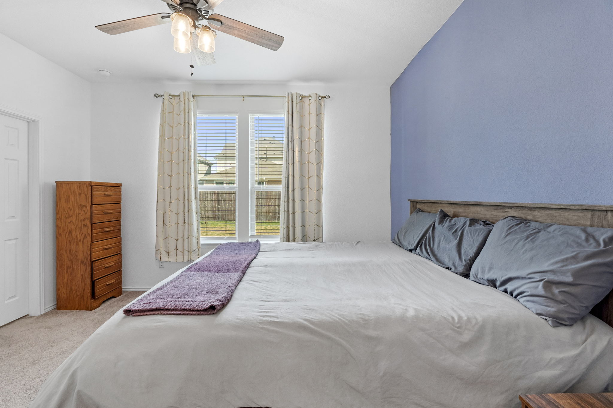 1600 Hope Rnch Road Leander, TX 78641 - Photo 14 of 23 a bed sitting in a bedroom next to a window