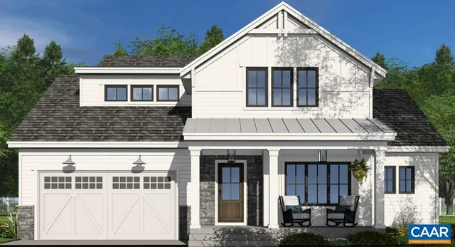 a view of a white house with large windows and a small yard