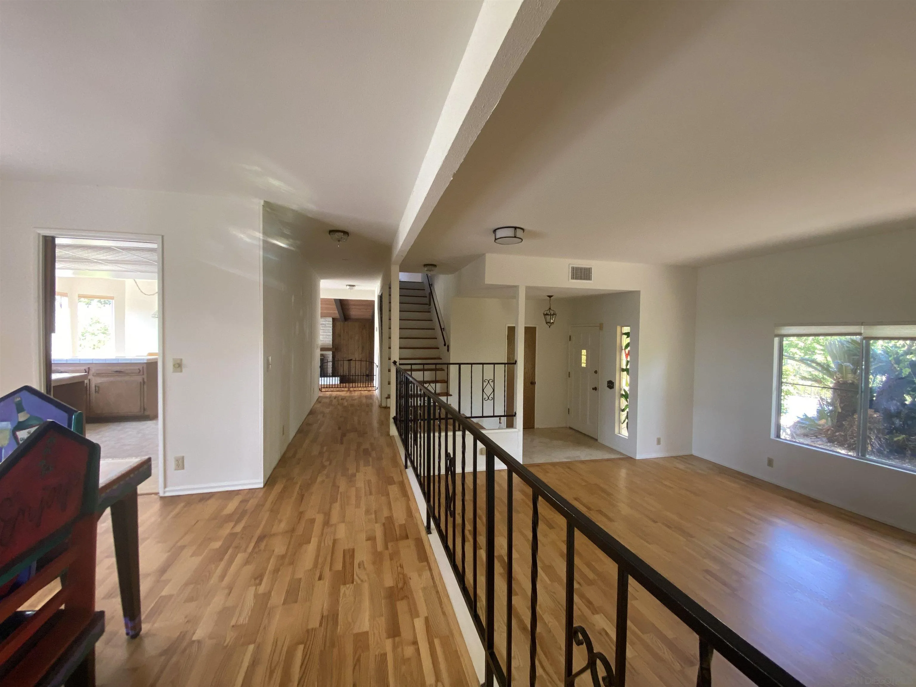 1780 Rabbit Hill Fallbrook, CA 92028 - Photo 21 of 60 a view of a hallway with wooden floor and windows