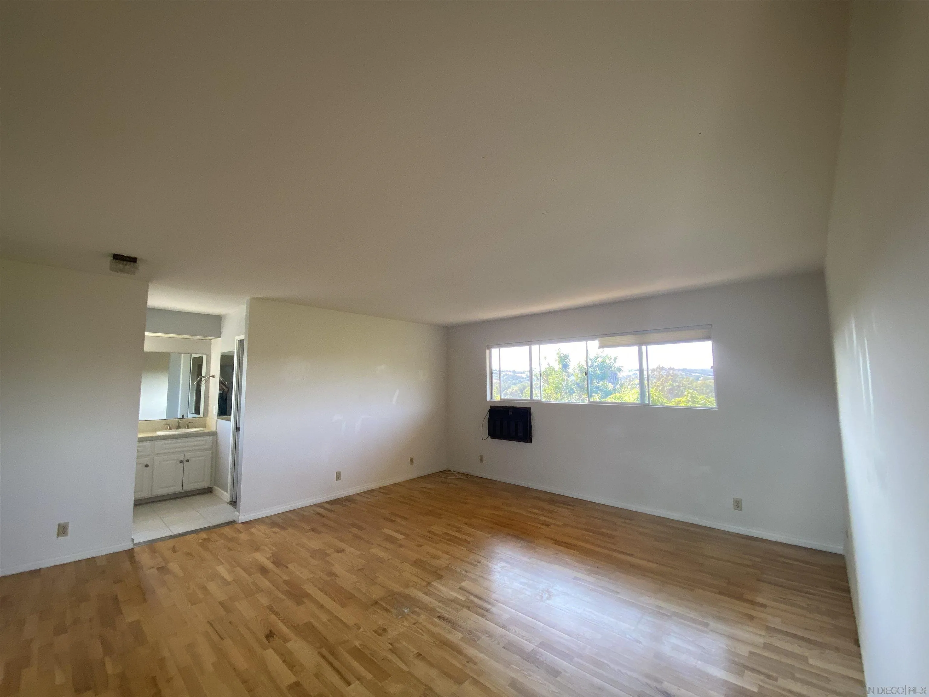 1780 Rabbit Hill Fallbrook, CA 92028 - Photo 34 of 60 a view of empty room with wooden floor and fan