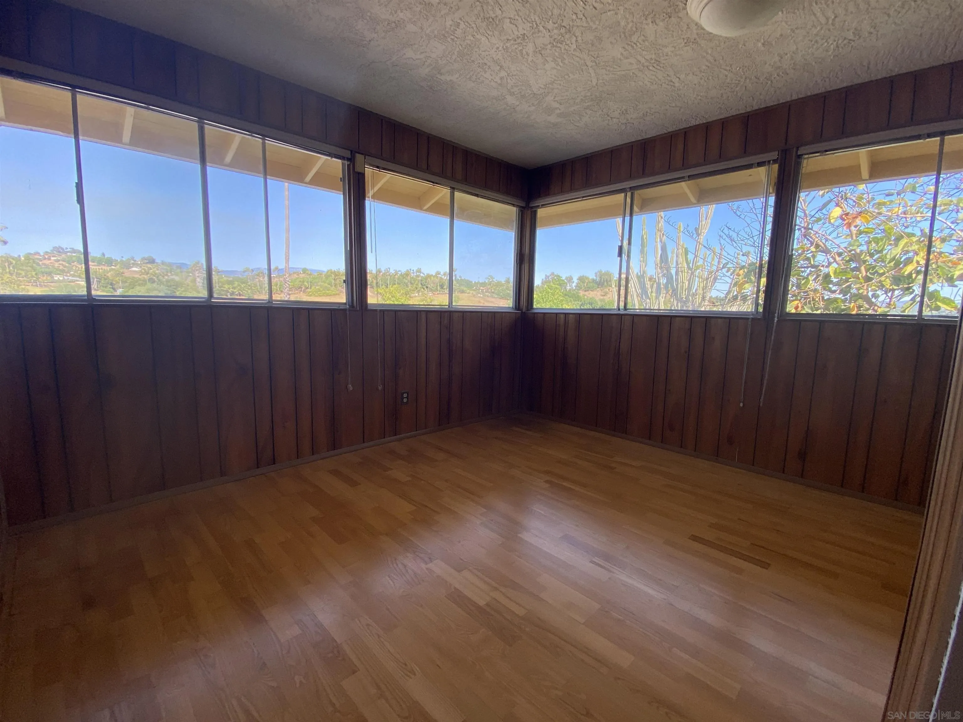 1780 Rabbit Hill Fallbrook, CA 92028 - Photo 37 of 60 wooden floor in an empty room with a window