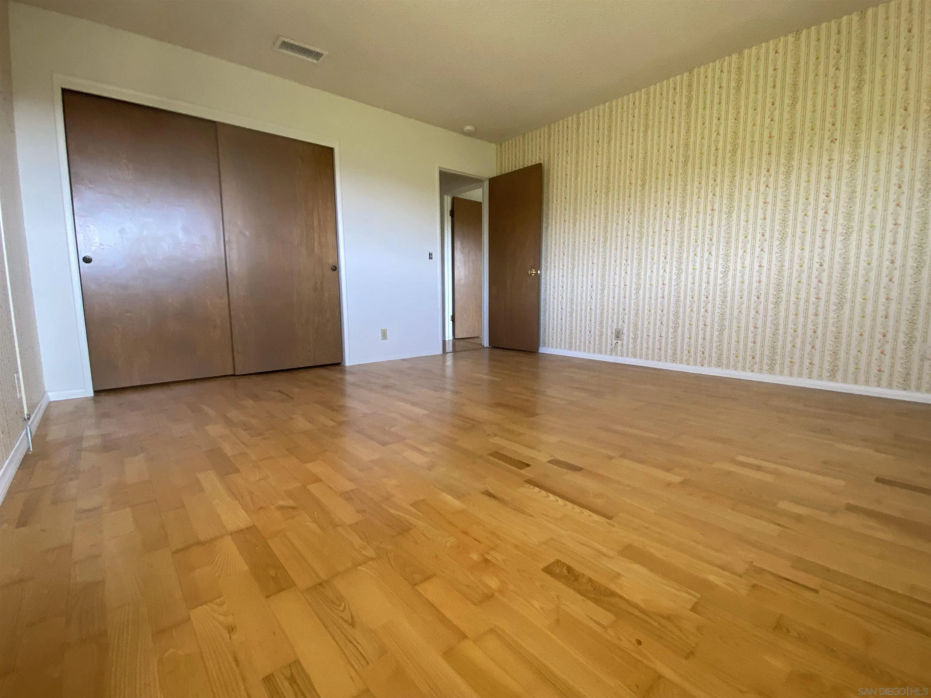 1780 Rabbit Hill Fallbrook, CA 92028 - Photo 41 of 60 a view of an empty room with wooden floor