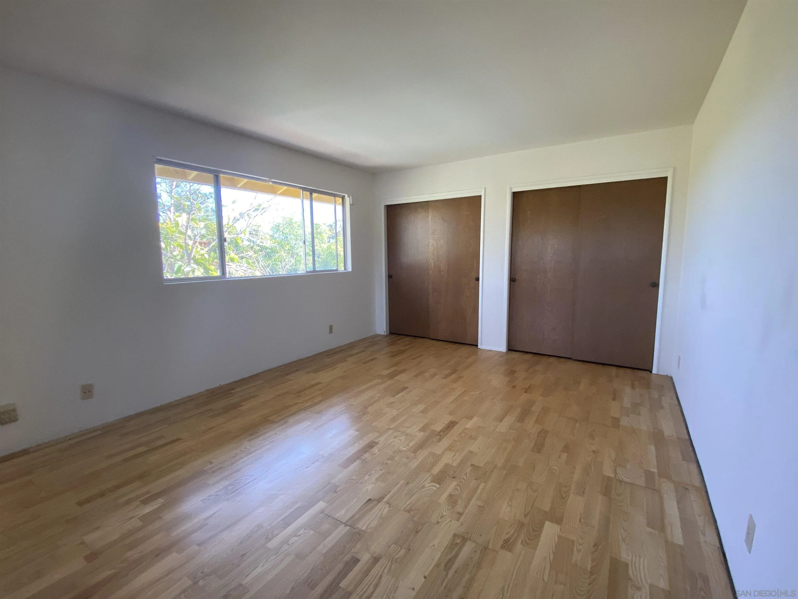 1780 Rabbit Hill Fallbrook, CA 92028 - Photo 43 of 60 an empty room with wooden floor and windows
