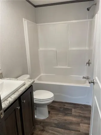 a bathroom with a sink a toilet and a bathtub