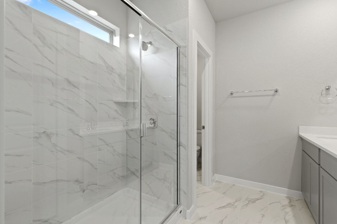 212 Lazy Lizzy Road Jarrell, TX 76537 - Photo 18 of 30 a bathroom with a shower and a sink