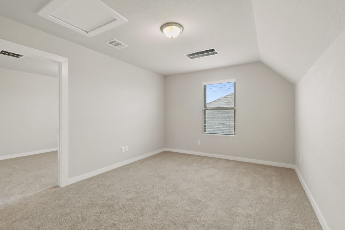 212 Lazy Lizzy Road Jarrell, TX 76537 - Photo 22 of 30 an empty room with windows and closet