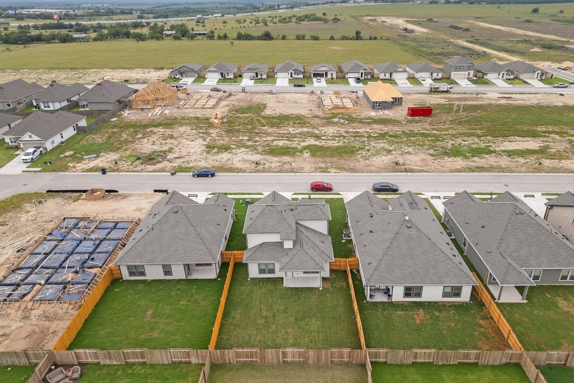 212 Lazy Lizzy Road Jarrell, TX 76537 - Photo 28 of 30 an aerial view of residential houses with outdoor space