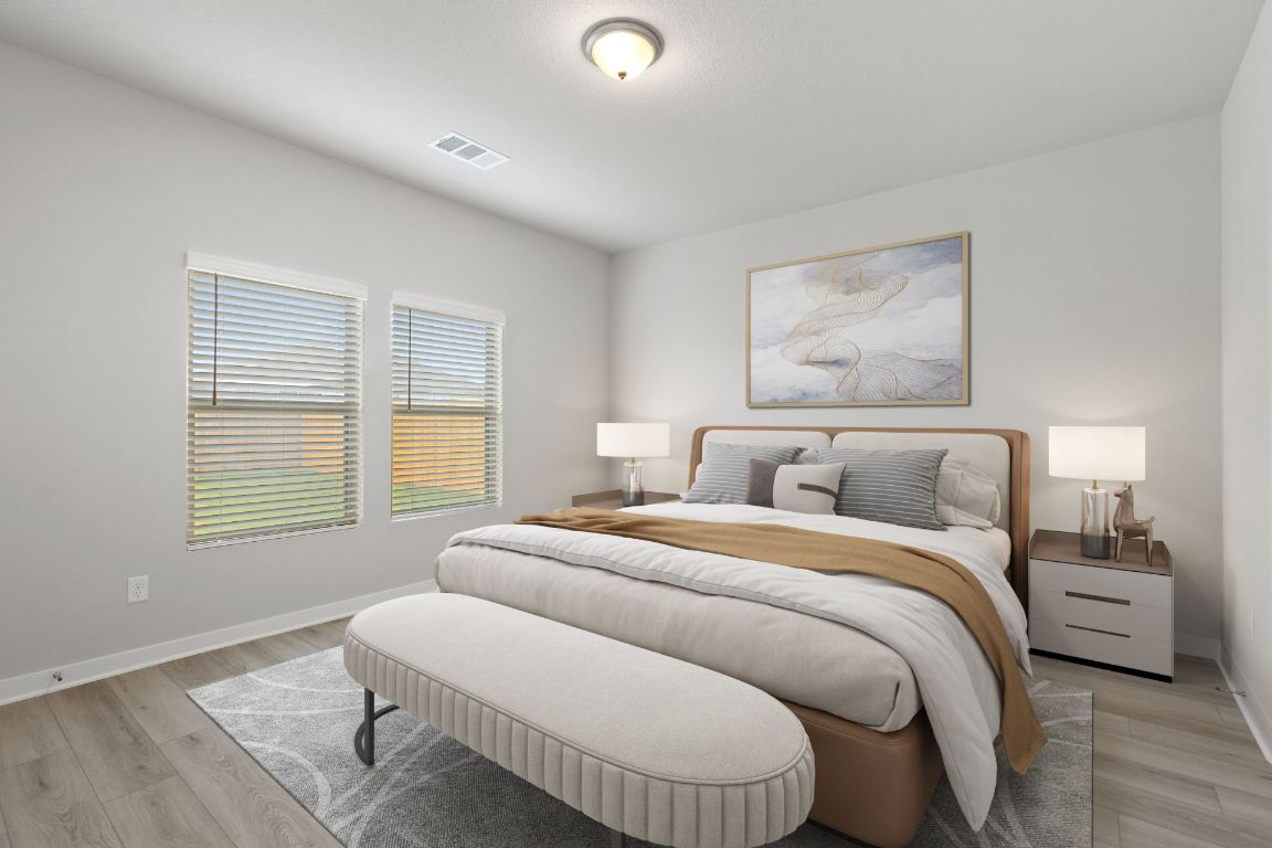 212 Lazy Lizzy Road Jarrell, TX 76537 - Photo 5 of 30 a bedroom with a bed and a window