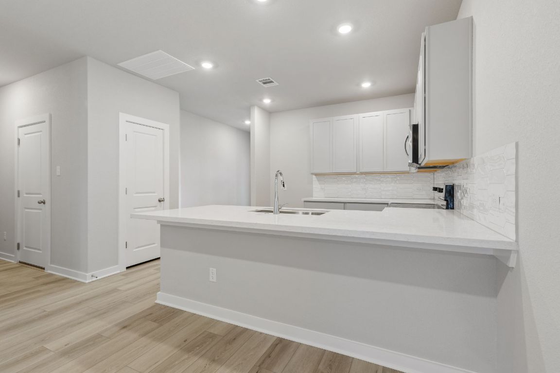 212 Lazy Lizzy Road Jarrell, TX 76537 - Photo 6 of 30 a view of a kitchen with a sink