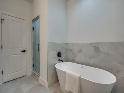 a white bath tub sitting in a bathroom