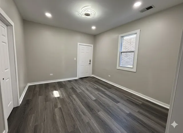 a view of a livingroom with wooden floor