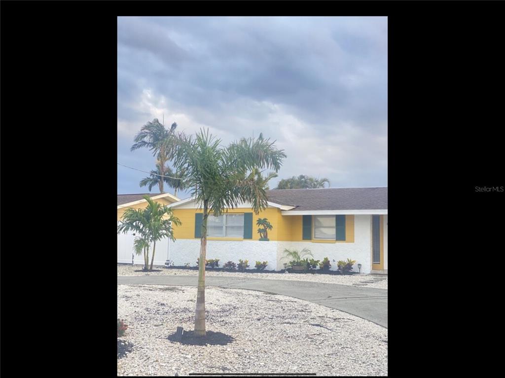 a view of a backyard of the house