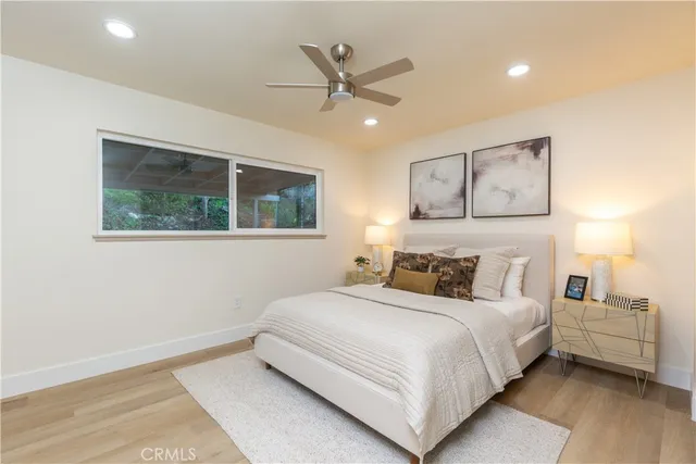 a bedroom with a large bed and a window