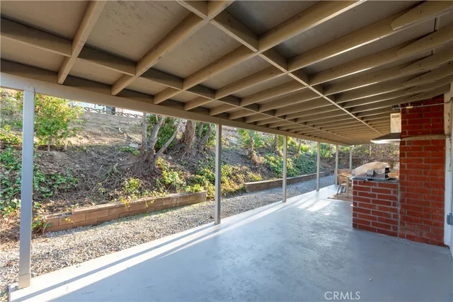a view of empty room with wooden walls