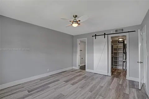 a view of a hardwood & staircase in a room