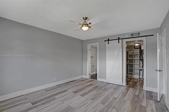 a view of a hardwood & staircase in a room