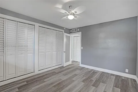 a bathroom with a sink toilet a mirror and shower