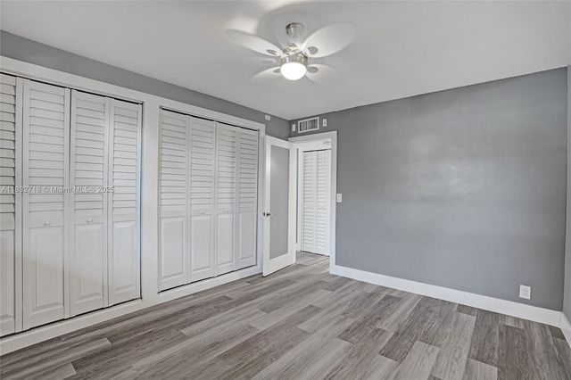 a bathroom with a sink toilet a mirror and shower