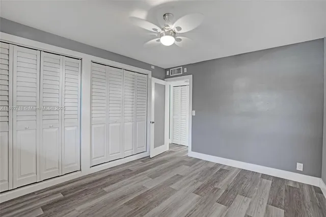 a bathroom with a sink toilet a mirror and shower