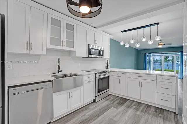 a kitchen with cabinets oven and a dishwasher