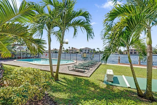 a view of a park with palm trees