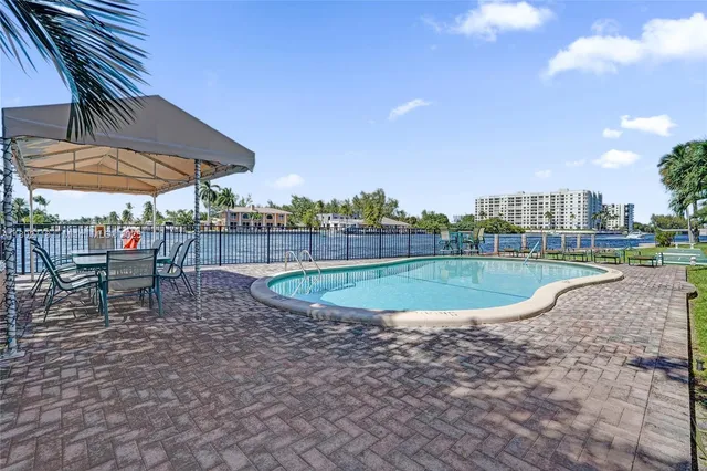 a view of a swimming pool with a terrace