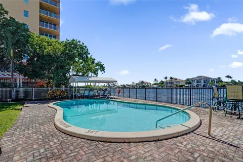 a view of a swimming pool with a patio
