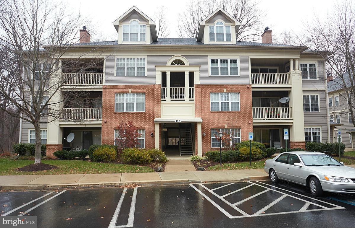 115 Timberbrook Lane, Unit 104 Gaithersburg, MD 20878 - Photo 24 of 28 a view of a white apartments with large windows
