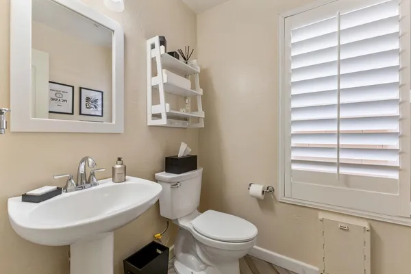 a kitchen with a stove a sink and a large window