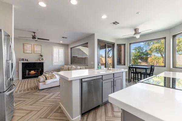 a large bedroom with a bed and a flat screen tv