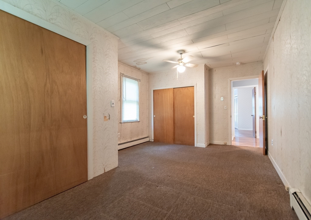 2 Raymond Street North Smithfield, RI 02896 - Photo 11 of 18 an empty room with windows and fan