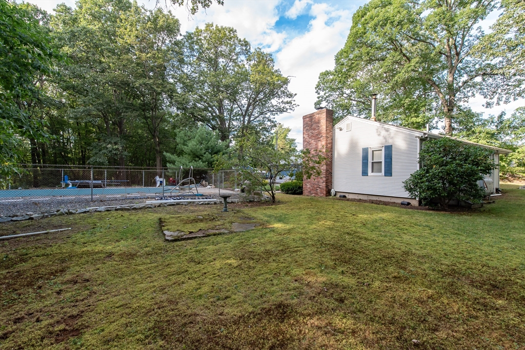 2 Raymond Street North Smithfield, RI 02896 - Photo 17 of 18 a view of a swimming pool with a house in the background