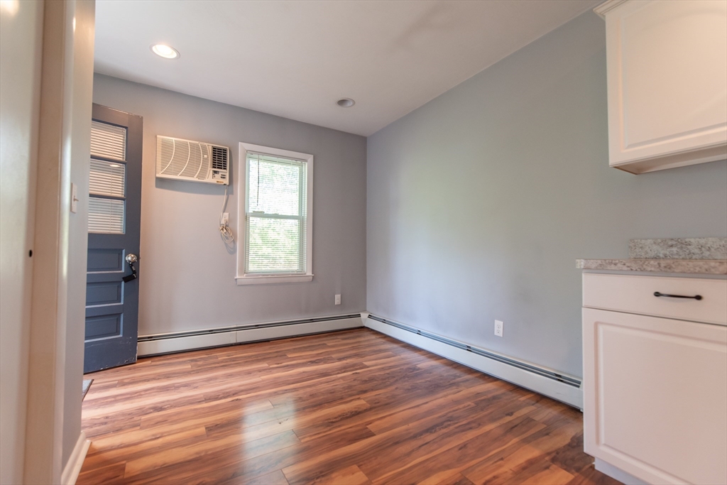 2 Raymond Street North Smithfield, RI 02896 - Photo 3 of 18 a view of empty room with wooden floor and fan
