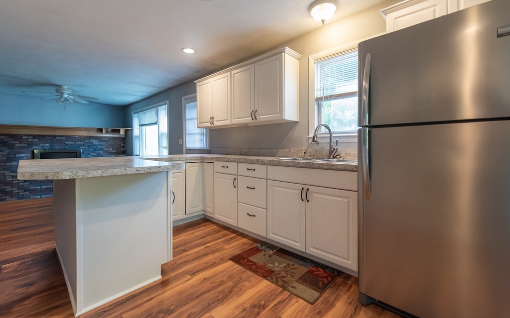 2 Raymond Street North Smithfield, RI 02896 - Photo 4 of 18 a kitchen with a sink appliances and cabinets