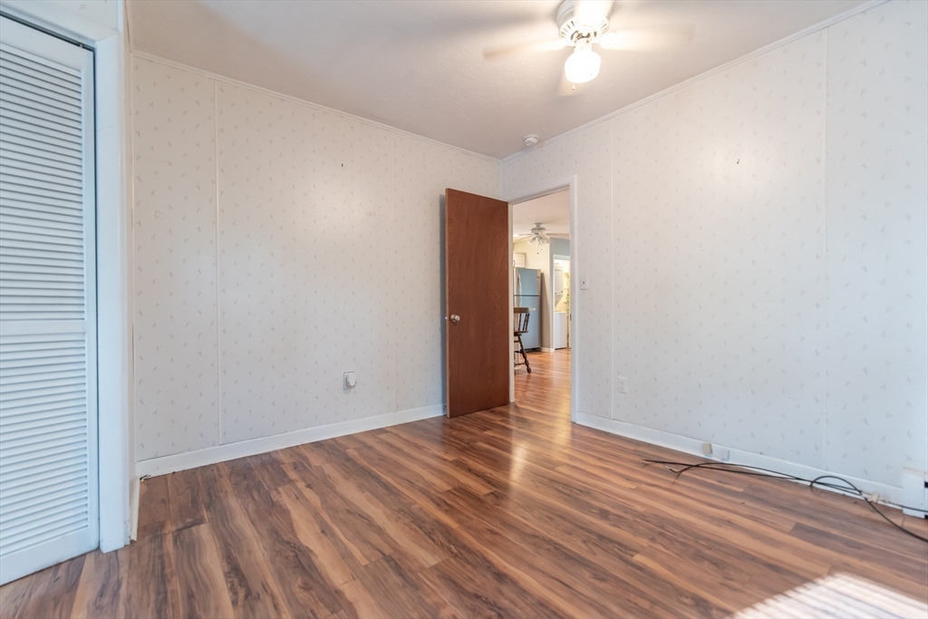 2 Raymond Street North Smithfield, RI 02896 - Photo 9 of 18 a view of an empty room with wooden floor
