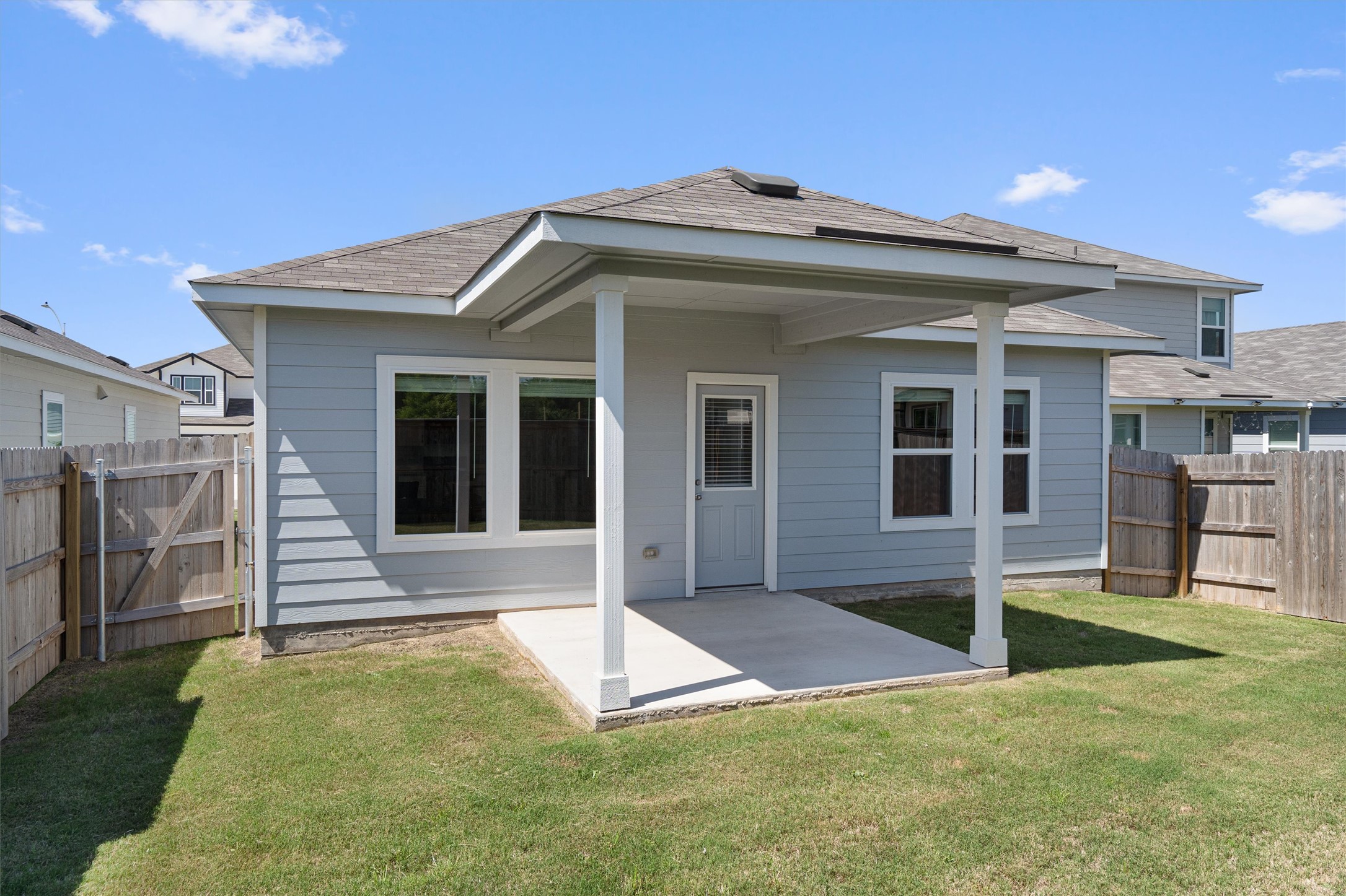 2606 Totley Road Manor, TX 78653 - Photo 24 of 28 a front view of a house with a yard