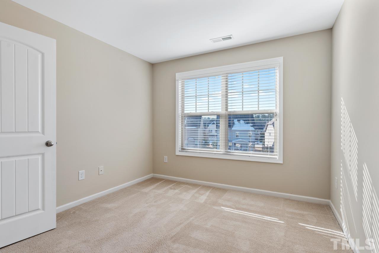 7705 Weathered Oak Way Raleigh, NC 27616 - Photo 20 of 26 a view of an empty room with a window