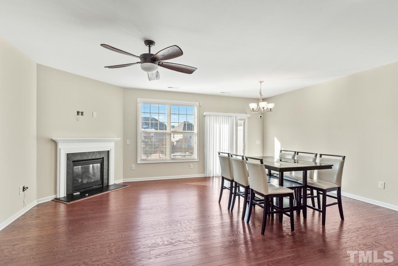 7705 Weathered Oak Way Raleigh, NC 27616 - Photo 2 of 26 a view of a dining room with furniture window and wooden floor