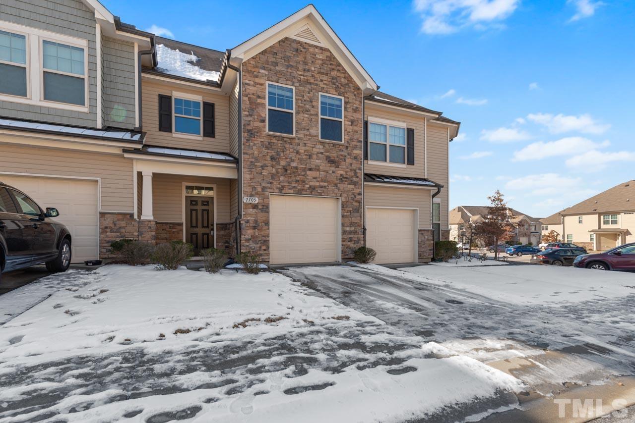 7705 Weathered Oak Way Raleigh, NC 27616 - Photo 23 of 26 a front view of a house with a yard