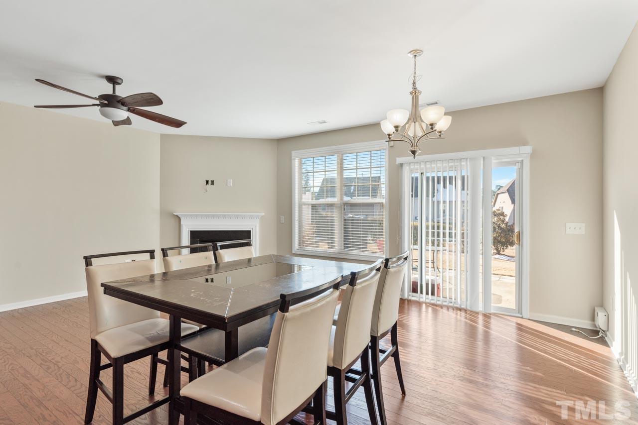 7705 Weathered Oak Way Raleigh, NC 27616 - Photo 7 of 26 a view of a dining room with furniture window and wooden floor